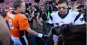 A handshake showing the respect that two of the greatest quarterbacks in the history of the NFL had for each other. 