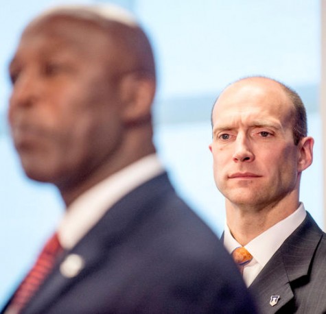 Whitman watches Lovie address the press