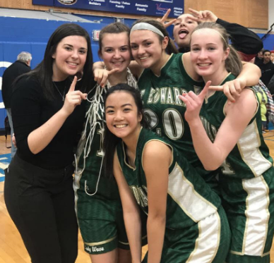 Manager Kelly Dalton celebrates the Lady Wave's sectional victory with seniors Brittany Mauritzen and Taylor Schueler and juniors Maddison Knott and Yssa Sto. Domingo.