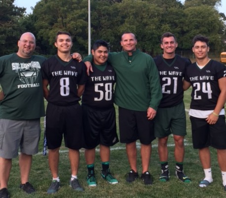 Members of the varsity football team after an interview for the Sideline Sports podcast.