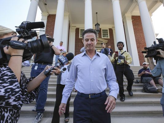 Rick Pitino leaving the board meeting where he was fired by the University’s board.