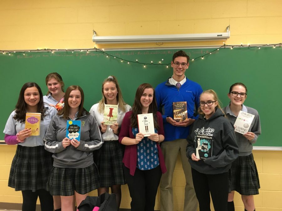 Members of Book Club, posing with their favorite books.  