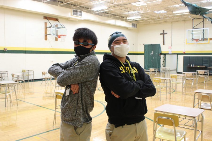 Members of the St. Edward Swim Team Nathan Mesina and Bobby Bansil are ready to see a new pool installed.
