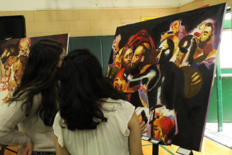 Students view their classmates art at the Fine Arts Festival.