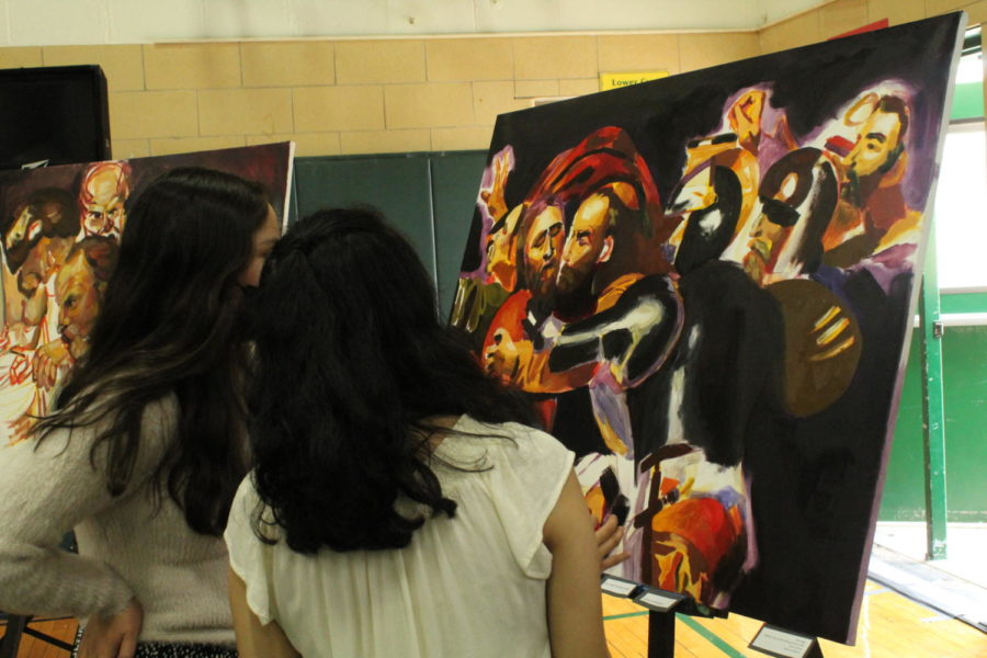 Students view their classmates' art at the Fine Arts Festival.