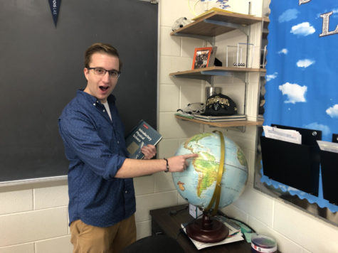 Mr. Kohls pointing to his favorite globe.