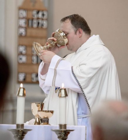 Fr. Blood drinks from the chalice at his ordination Mass