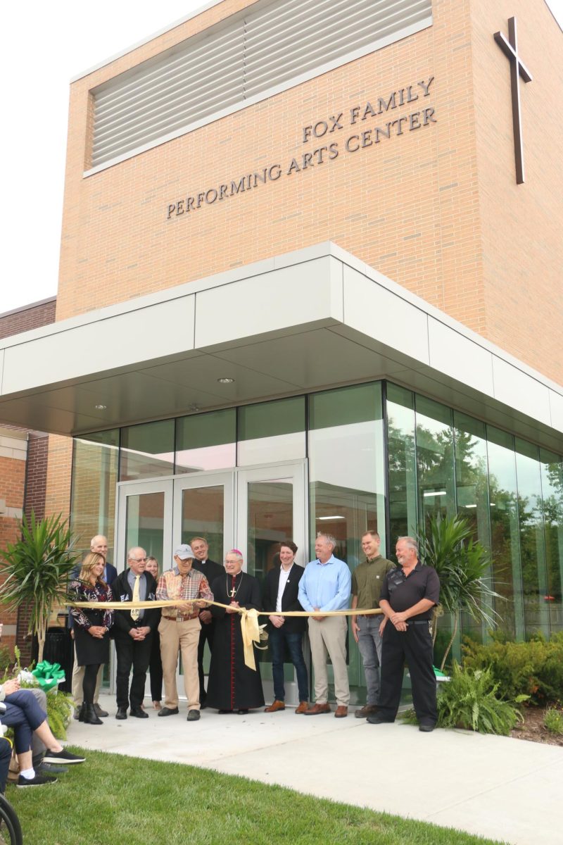 Geoff Fox cuts the ceremonial ribbon, signifying the official opening of the Fox Family Performing Arts Center.