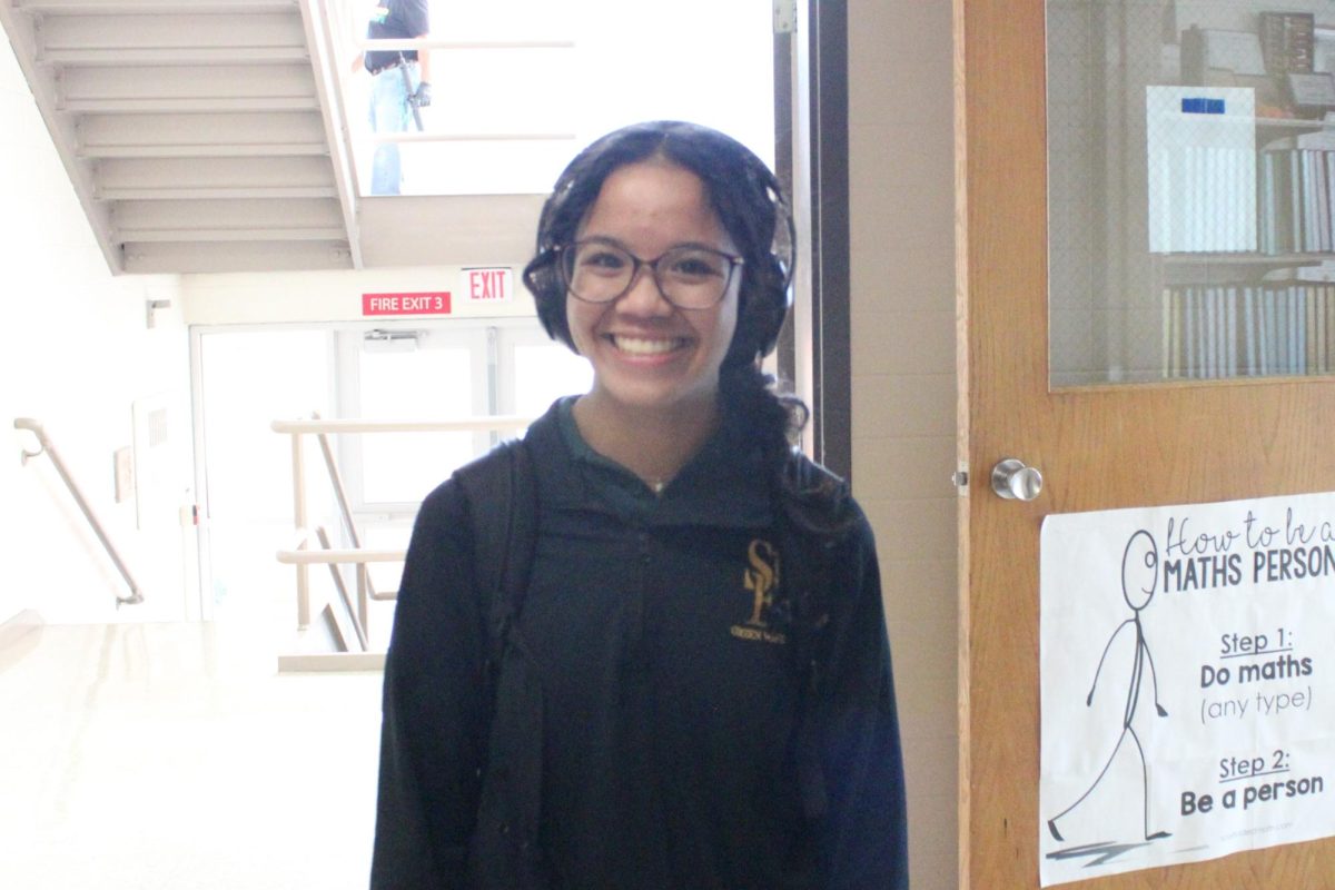 Scarlett Sasis in the hallway listening to music!